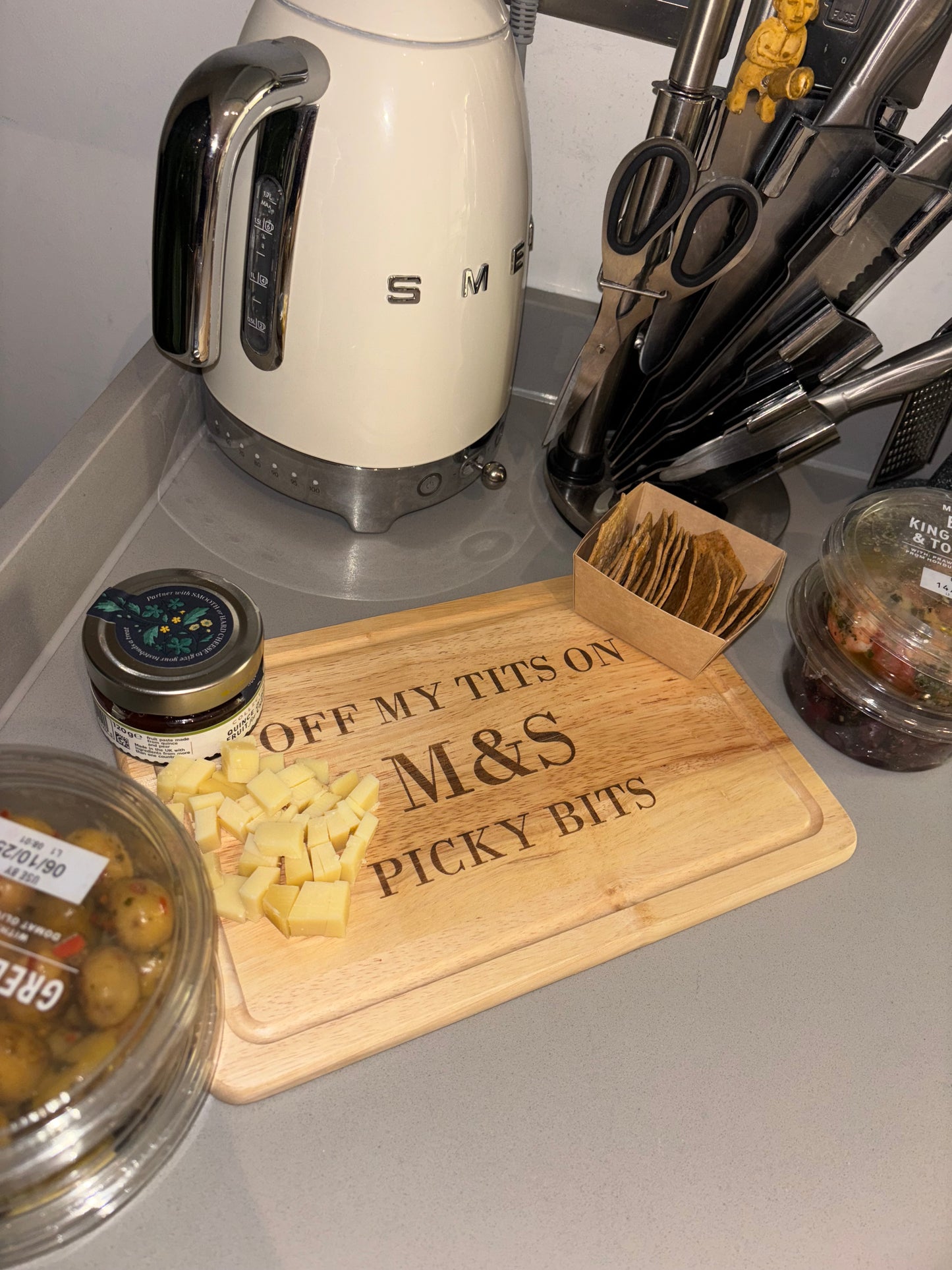 Off my tits on M&S picky bits engraved chopping / cheese board. Viral slogan