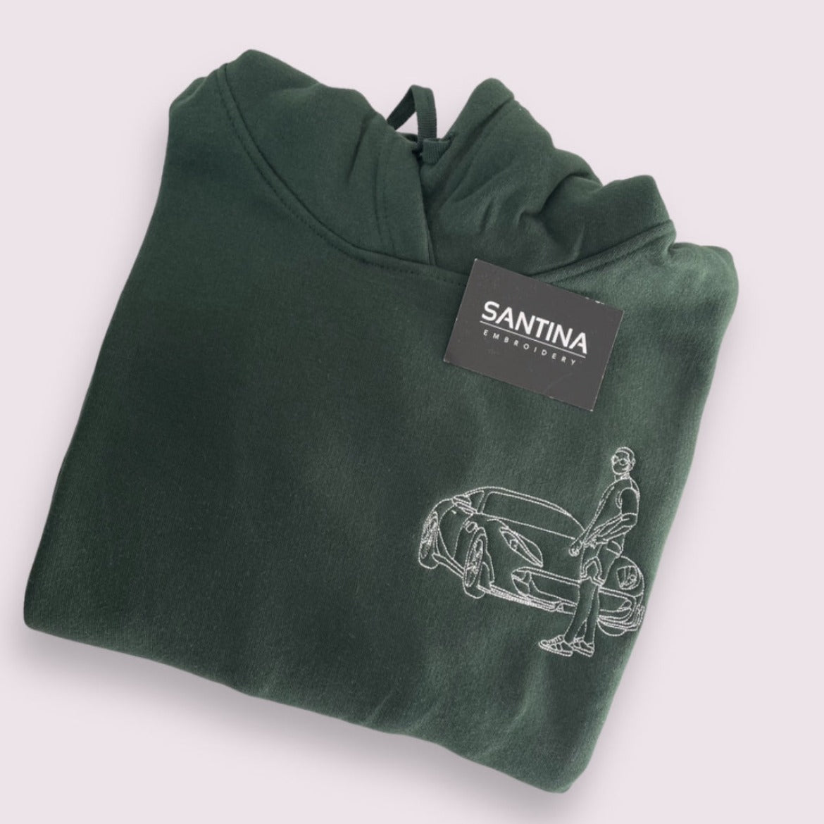 Personalized hoodie with an intricately embroidered portrait outline of a special memory