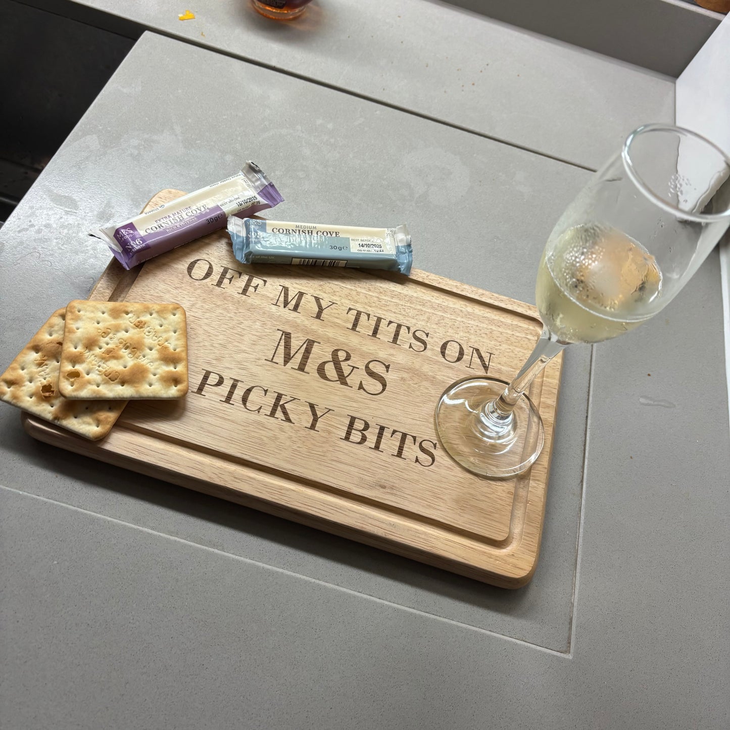 Off my tits on M&S picky bits engraved chopping / cheese board. Viral slogan
