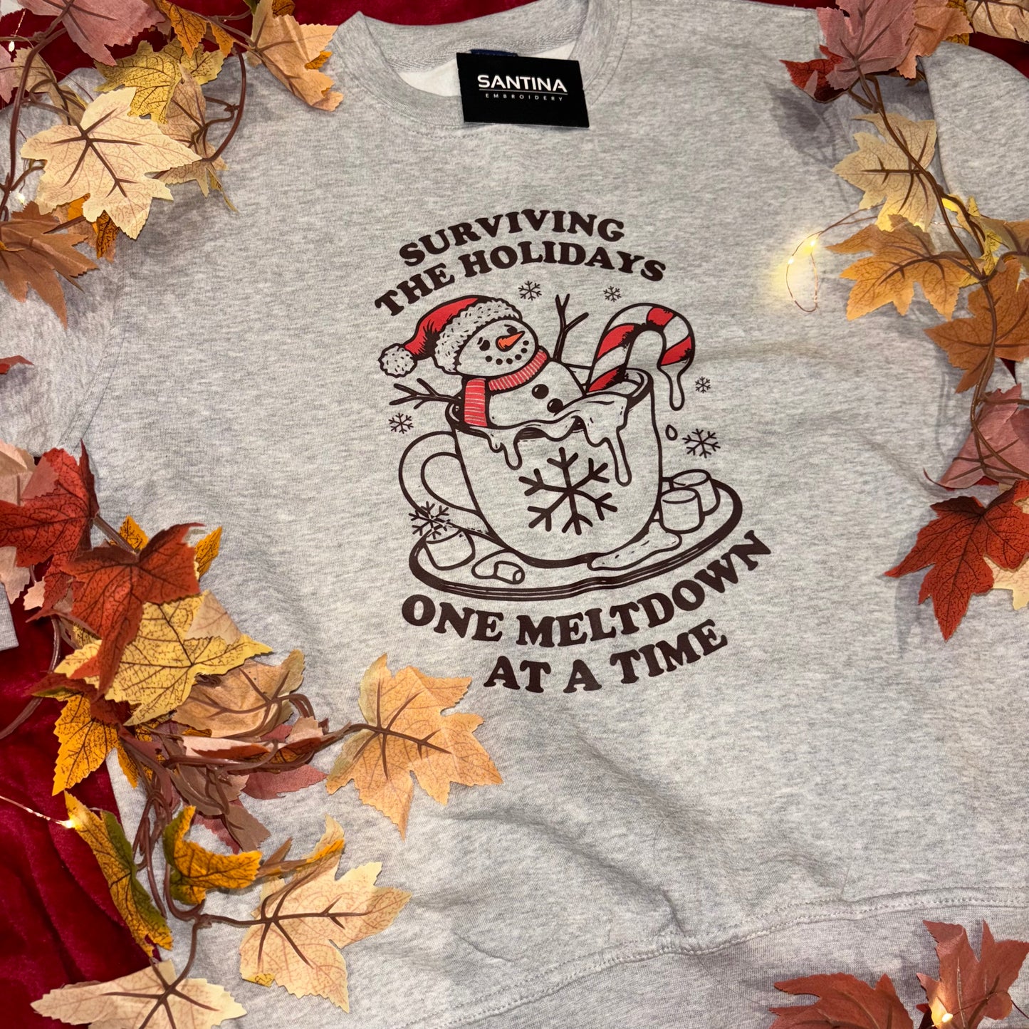 Surviving the holidays one meltdown at a time printed crewneck