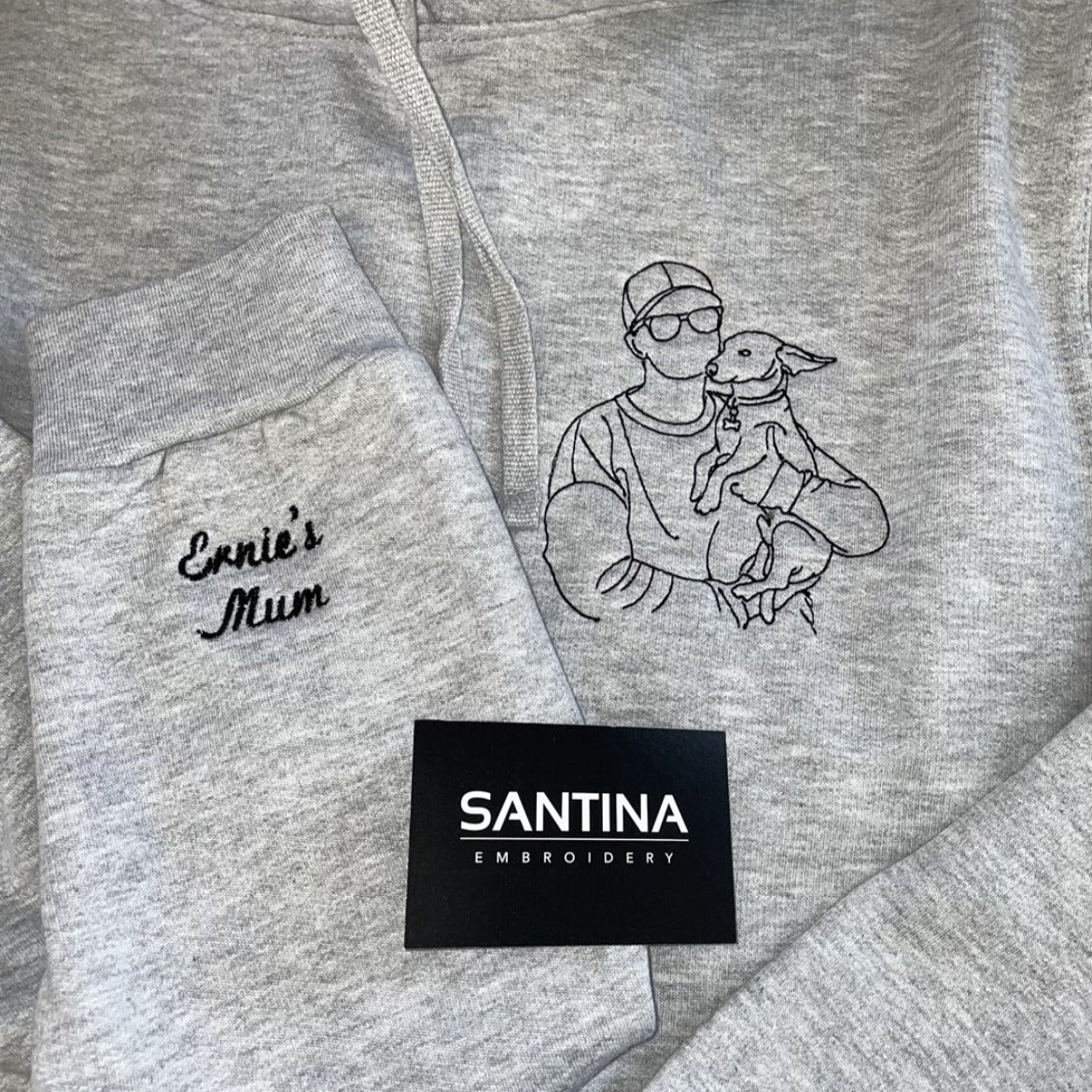 Personalized sweatshirt with an embroidered portrait outline of a beloved pet