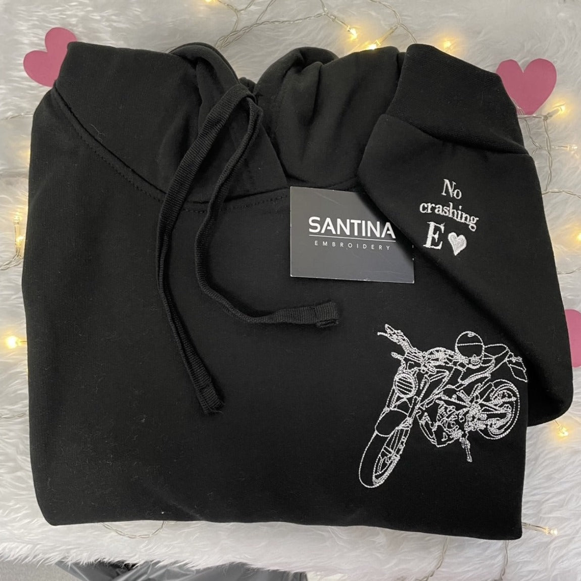 Personalized hoodie with an intricately embroidered portrait outline of a special memory