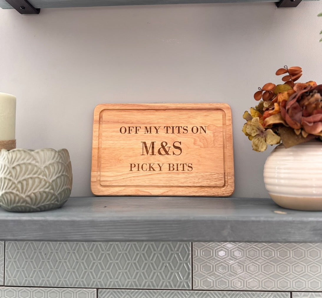 Off my tits on M&S picky bits engraved chopping / cheese board. Viral slogan