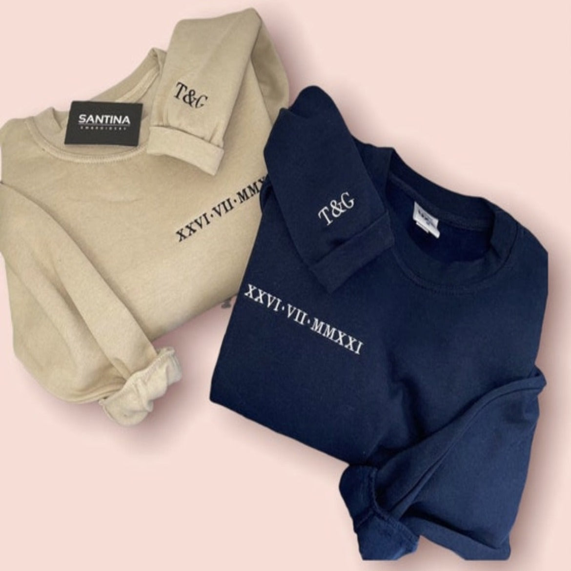 Stylish embroidered sweatshirt with Roman numerals and navy blue and beige fabric.