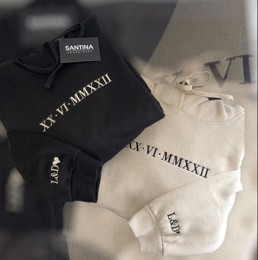 Custom black hoodie with unique Roman numeral embroidery